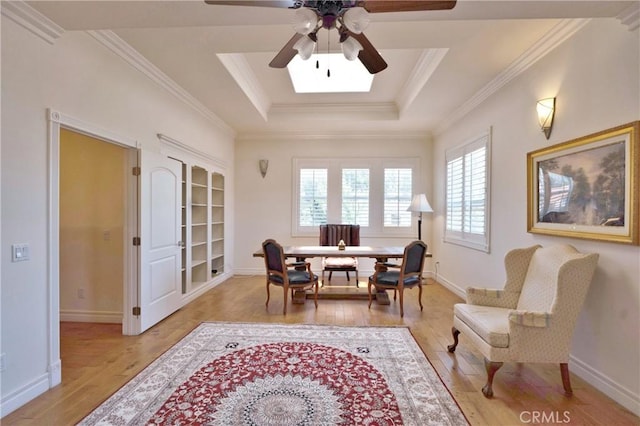 2767 Saleroso Dr, Rowland Heights, CA 91748 - dining room with light wood-style flooring, ceiling fan, a raised ceiling, crown molding, and baseboards