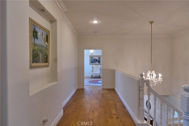 2767 Saleroso Dr, Rowland Heights, CA 91748 - corridor with hardwood / wood-style floors, a chandelier, ornamental molding, an upstairs landing, and baseboards