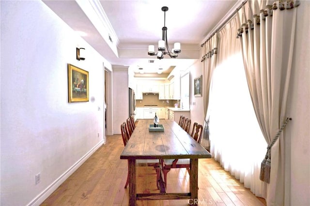 2767 Saleroso Dr, Rowland Heights, CA 91748 - dining space featuring a chandelier, light wood-style floors, baseboards, and ornamental molding