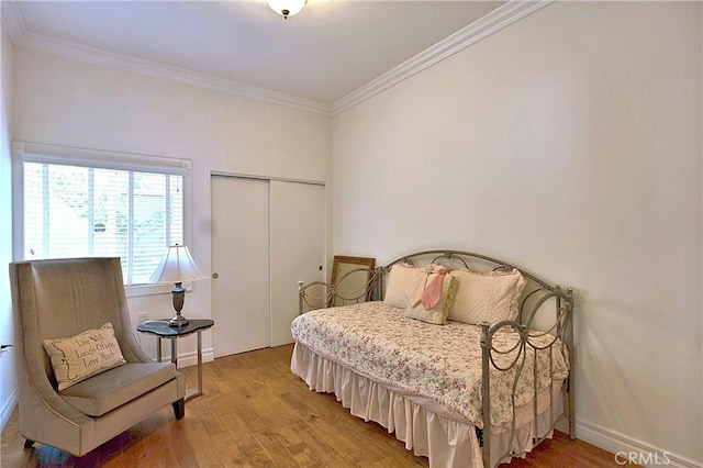 2767 Saleroso Dr, Rowland Heights, CA 91748 - bedroom with light wood-type flooring, ornamental molding, and a closet