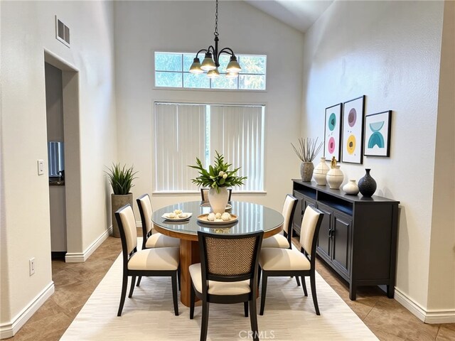 28594 Moon Shadow Dr, Menifee, CA 92584 - dining space featuring a chandelier, high vaulted ceiling, and light tile patterned flooring