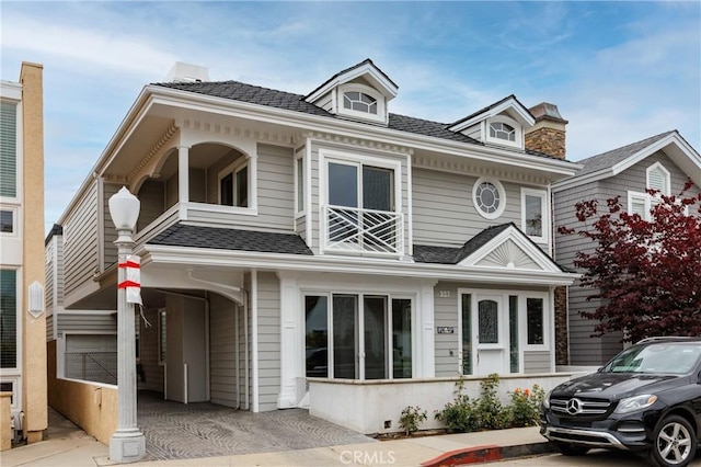 327 Amethyst Ave, Newport Beach, CA 92662 - view of front facade with roof with shingles and a chimney