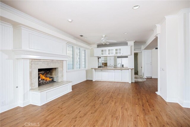 327 Amethyst Ave, Newport Beach, CA 92662 - unfurnished living room featuring ceiling fan, a fireplace, light wood-type flooring, baseboards, and recessed lighting