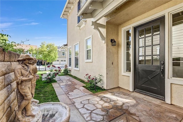 23922 Lakeside Rd, Valencia, CA 91355 - entrance to property with stucco siding and a patio area