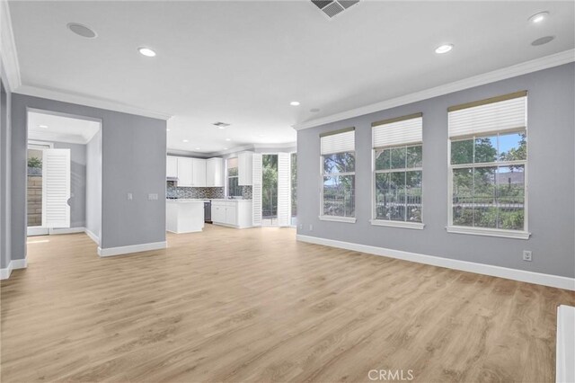 23922 Lakeside Rd, Valencia, CA 91355 - unfurnished living room with ornamental molding, baseboards, recessed lighting, and light wood-type flooring