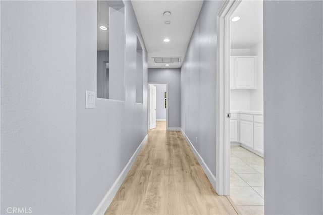 23922 Lakeside Rd, Valencia, CA 91355 - corridor with light wood finished floors, baseboards, and recessed lighting