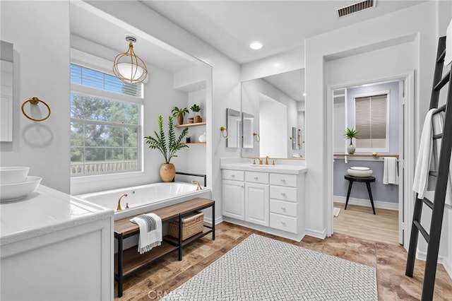 23922 Lakeside Rd, Valencia, CA 91355 - full bathroom with vanity, a bath, baseboards, and recessed lighting