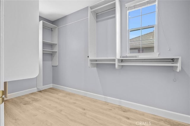 23922 Lakeside Rd, Valencia, CA 91355 - spacious closet featuring wood finished floors