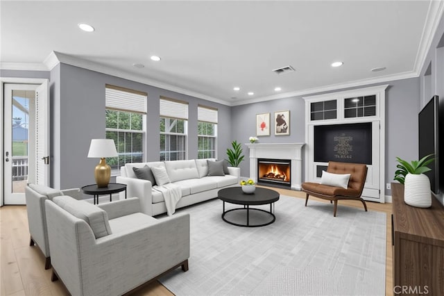 23922 Lakeside Rd, Valencia, CA 91355 - living area featuring ornamental molding, light wood-style flooring, recessed lighting, and a fireplace with flush hearth