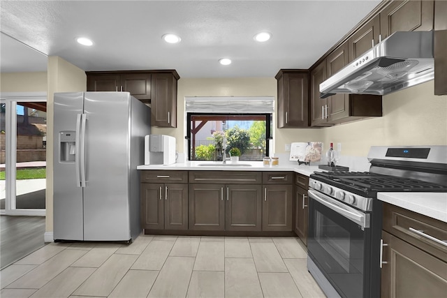 1903 Tomas Ct, Rowland Heights, CA 91748 - kitchen featuring stainless steel appliances, under cabinet range hood, dark brown cabinets, light countertops, and recessed lighting