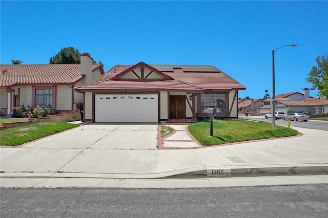 1903 Tomas Ct, Rowland Heights, CA 91748 - view of front of house featuring a tiled roof, solar panels, stucco siding, driveway, and a garage