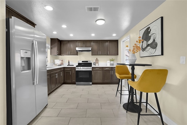 1903 Tomas Ct, Rowland Heights, CA 91748 - kitchen featuring stainless steel appliances, dark brown cabinets, light countertops, a sink, and recessed lighting