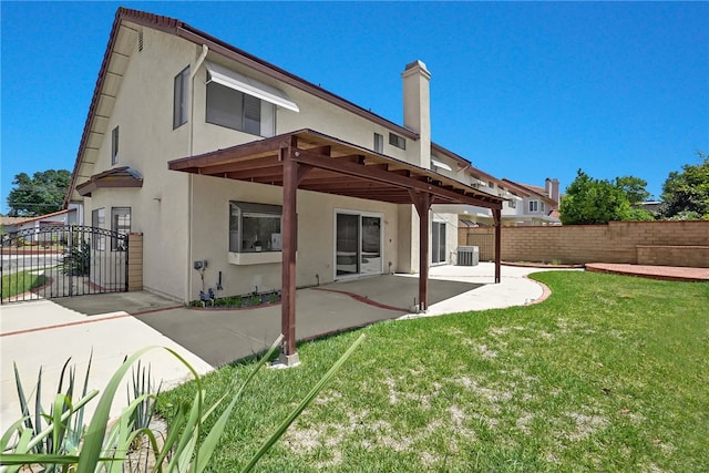 1903 Tomas Ct, Rowland Heights, CA 91748 - back of house featuring stucco siding, a patio area, central AC, and a chimney