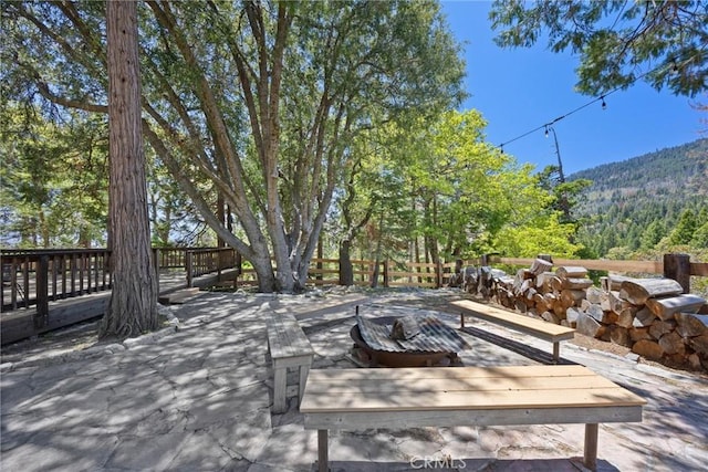 10820 Bonita Way, Wofford Heights, CA 93285 - deck featuring a fire pit and a view of trees