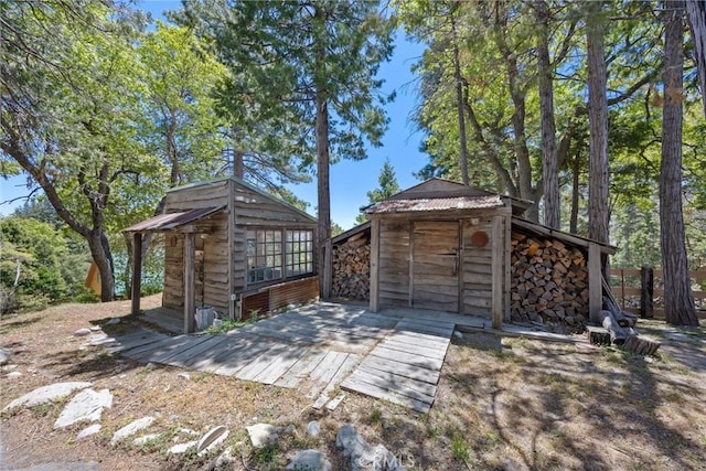 10820 Bonita Way, Wofford Heights, CA 93285 - view of patio featuring an outdoor structure and a wooden deck