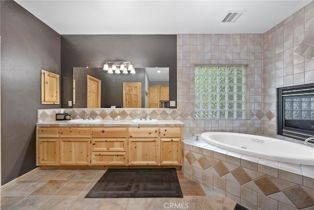10820 Bonita Way, Wofford Heights, CA 93285 - full bath featuring double vanity, a tub with jets, decorative backsplash, and baseboards