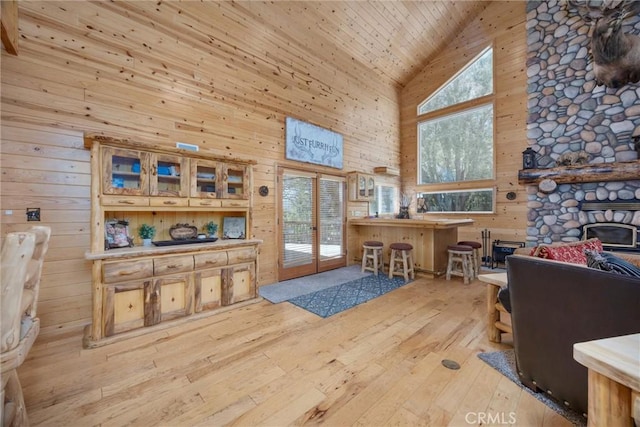 10820 Bonita Way, Wofford Heights, CA 93285 - living area featuring high vaulted ceiling, french doors, hardwood / wood-style flooring, wood walls, and wooden ceiling