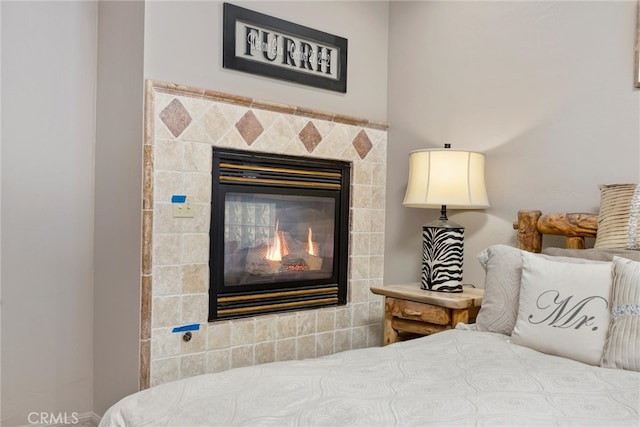 10820 Bonita Way, Wofford Heights, CA 93285 - bedroom featuring a glass covered fireplace