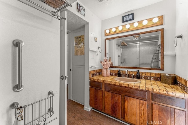 30211 Via Rivera, Rancho Palos Verdes, CA 90275 - full bathroom with an enclosed shower, vanity, wood finished floors, and a textured ceiling