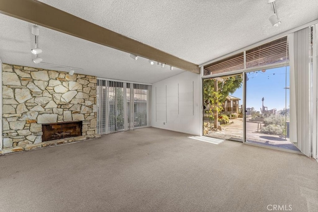 30211 Via Rivera, Rancho Palos Verdes, CA 90275 - unfurnished living room featuring track lighting, a wall of windows, a textured ceiling, healthy amount of natural light, and carpet