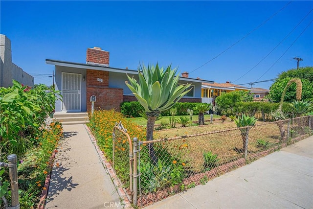 521 W Erna Ave, La Habra, CA 90631 - view of front of home with a chimney and brick siding