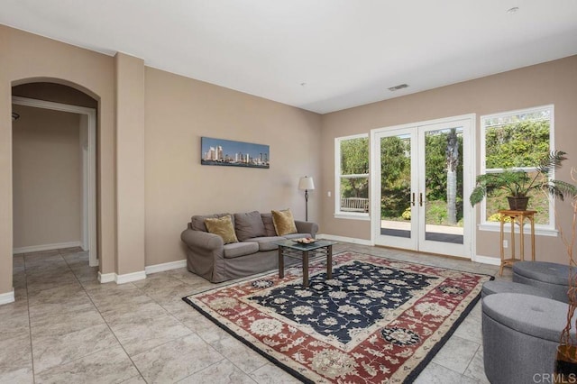 435 Sandalwood Ct, Encinitas, CA 92024 - living area with arched walkways, french doors, and baseboards