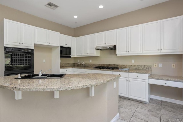 435 Sandalwood Ct, Encinitas, CA 92024 - kitchen with black appliances, a sink, white cabinetry, and recessed lighting