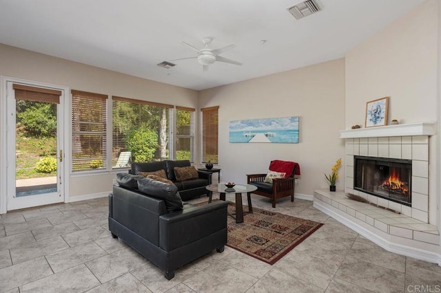 435 Sandalwood Ct, Encinitas, CA 92024 - living area with a ceiling fan, healthy amount of natural light, a tiled fireplace, and light tile patterned floors