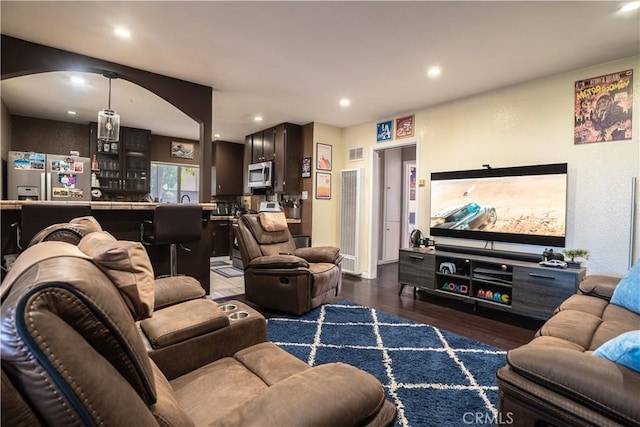 11737 Bellman Ave, Downey, CA 90241 - living area with a heating unit, wood finished floors, and recessed lighting