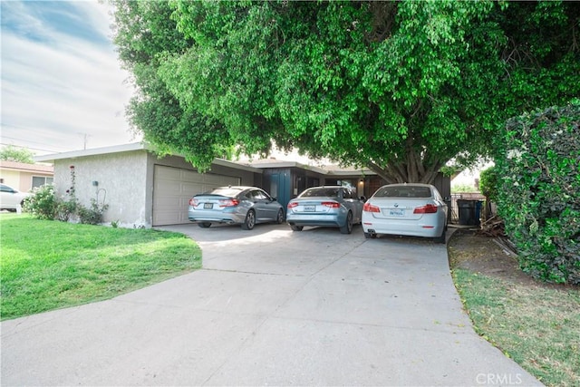 11737 Bellman Ave, Downey, CA 90241 - view of front facade featuring a garage, driveway, stucco siding, and a front yard