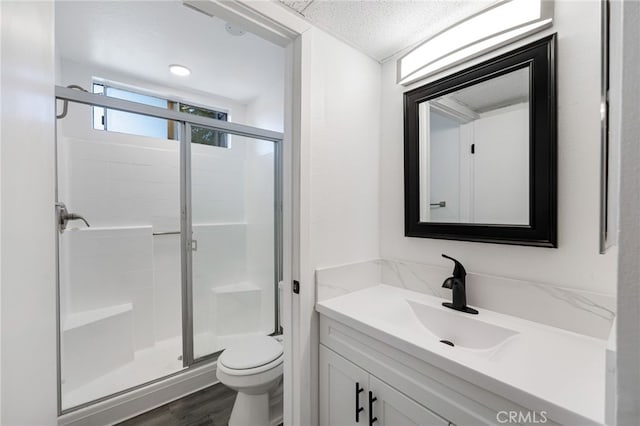 4406 Cahuenga Blvd, Toluca Lake, CA 91602 - full bathroom with vanity, toilet, a stall shower, and wood finished floors