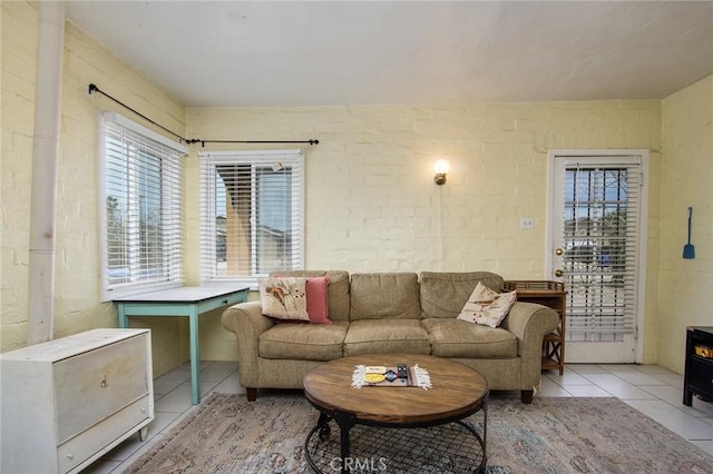 6155 Cahuilla Ave Unit 29, Palms, CA 92277 - living room featuring light tile patterned flooring and healthy amount of natural light