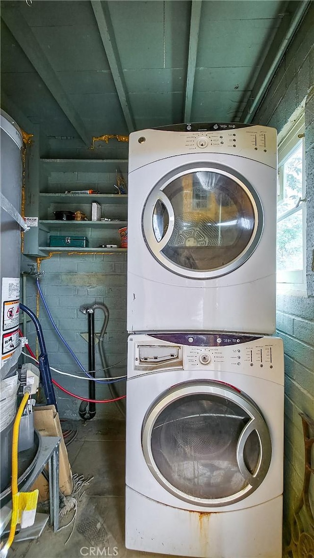 6155 Cahuilla Ave Unit 29, Palms, CA 92277 - laundry room with estacked washer and dryer and concrete block wall