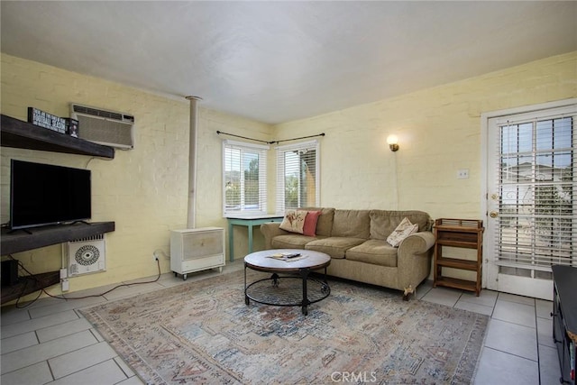6155 Cahuilla Ave Unit 29, Palms, CA 92277 - tiled living room with a wall mounted air conditioner