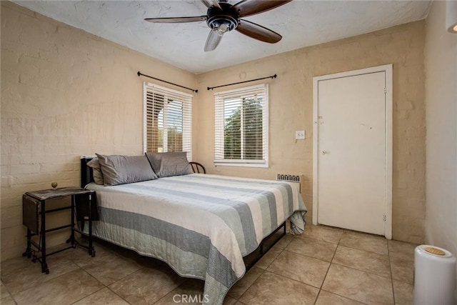6155 Cahuilla Ave Unit 29, Palms, CA 92277 - bedroom featuring tile patterned floors and a ceiling fan