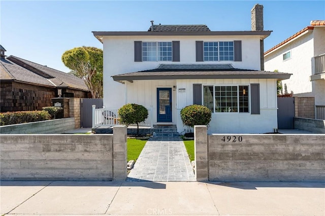 4920 Island View St, Oxnard, CA 93035 - view of front facade featuring a chimney and a gate