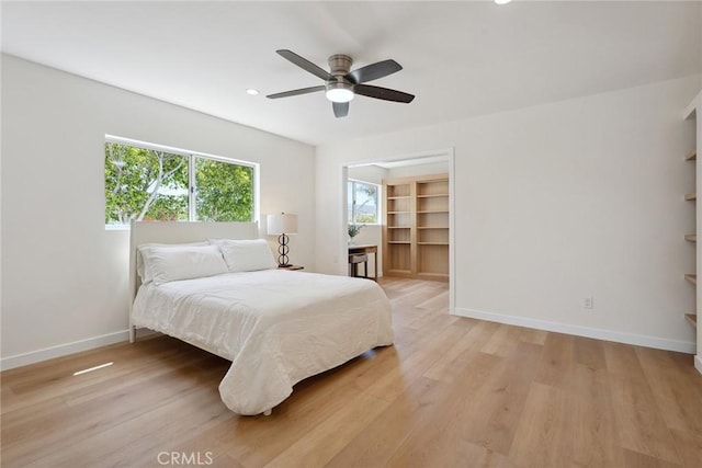 4920 Island View St, Oxnard, CA 93035 - bedroom featuring baseboards, light wood-style floors, a ceiling fan, recessed lighting, and a walk in closet