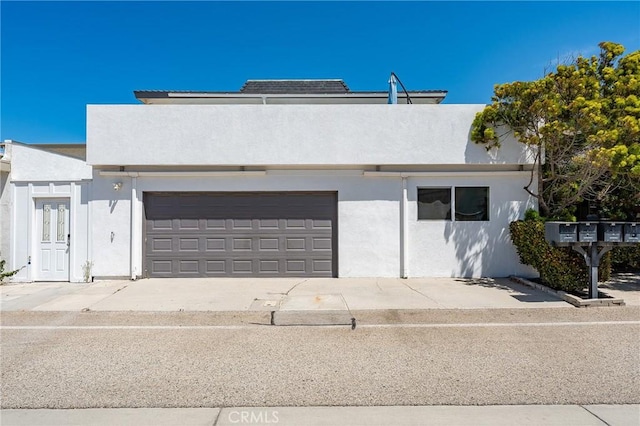 4920 Island View St, Oxnard, CA 93035 - townhome / multi-family property with stucco siding, a garage, and concrete driveway