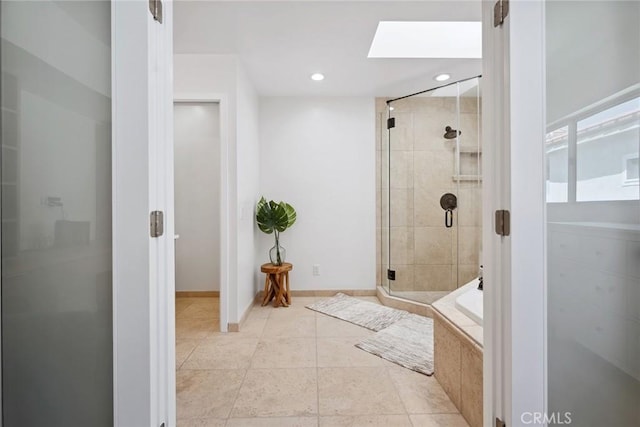 4920 Island View St, Oxnard, CA 93035 - bathroom featuring a shower stall, a skylight, a bath, baseboards, and recessed lighting