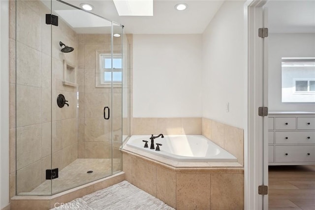 4920 Island View St, Oxnard, CA 93035 - bathroom featuring a garden tub, a shower stall, a skylight, and recessed lighting