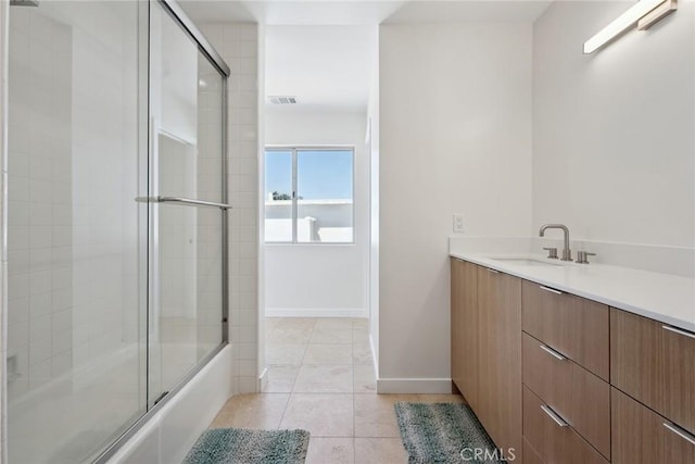 4920 Island View St, Oxnard, CA 93035 - full bath with vanity, combined bath / shower with glass door, tile patterned floors, and baseboards