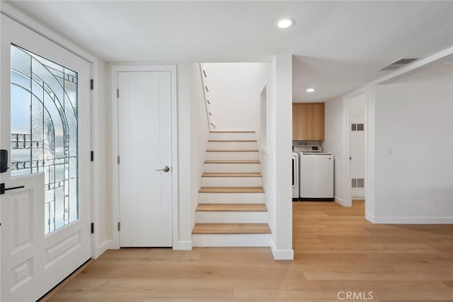 4920 Island View St, Oxnard, CA 93035 - foyer featuring washing machine and dryer, light wood-type flooring, baseboards, stairs, and recessed lighting