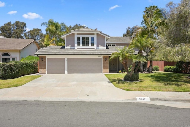3442 Celinda Dr, Carlsbad, CA 92008 - traditional home featuring driveway, brick siding, and an attached garage