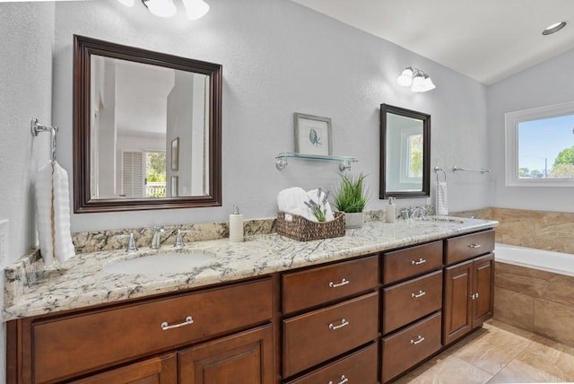 3442 Celinda Dr, Carlsbad, CA 92008 - bathroom with double vanity, a garden tub, and lofted ceiling