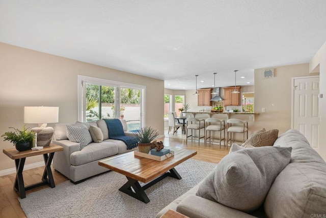 3442 Celinda Dr, Carlsbad, CA 92008 - living area with light wood-style floors and recessed lighting