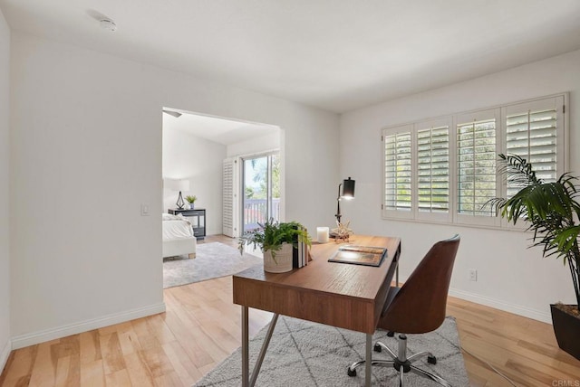 3442 Celinda Dr, Carlsbad, CA 92008 - home office with light wood-style floors and baseboards