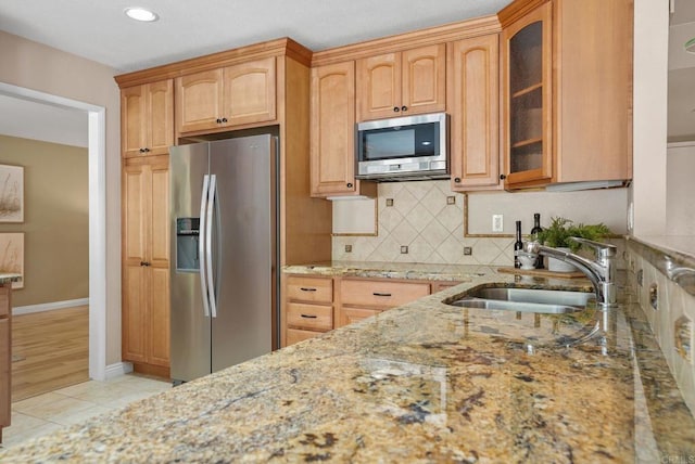 3442 Celinda Dr, Carlsbad, CA 92008 - kitchen with stainless steel appliances, light stone countertops, tasteful backsplash, glass insert cabinets, and recessed lighting