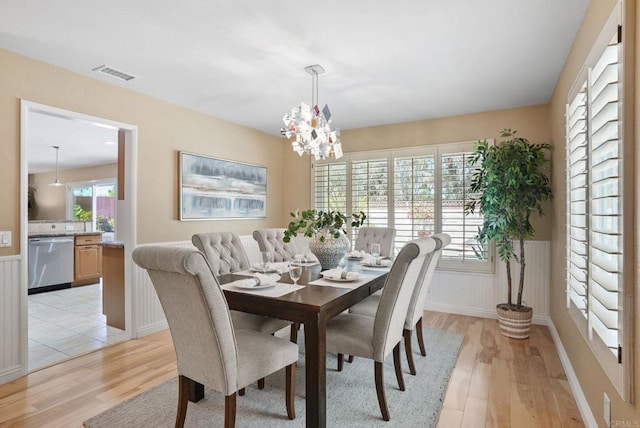 3442 Celinda Dr, Carlsbad, CA 92008 - dining room with light wood-style flooring and a chandelier