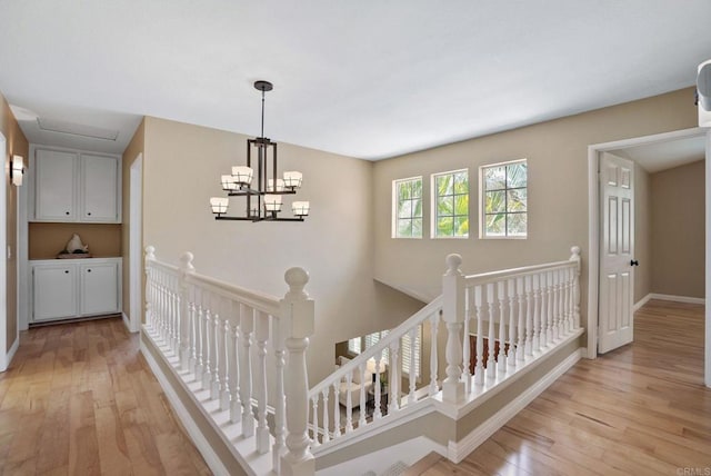 3442 Celinda Dr, Carlsbad, CA 92008 - hallway featuring an upstairs landing, light wood-type flooring, and a chandelier