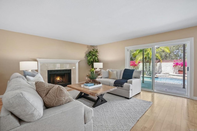 3442 Celinda Dr, Carlsbad, CA 92008 - living area with light wood-style flooring and a fireplace